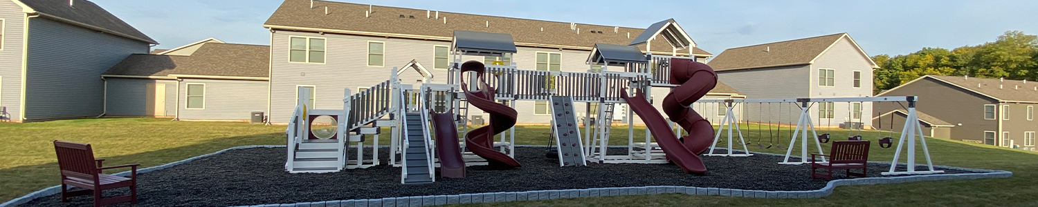 gray playground with mulch